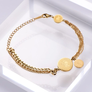 Gold multilayer chain bracelet with Queen Elizabeth II coin charms on a white background