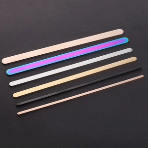 Close-up of polished stainless steel blank bars in multiple colors for DIY engraving