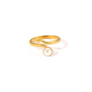 Detailed view of snake-shaped golden titanium steel ring with a white pearl inlay