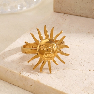 18K gold plated stainless steel sun ring with face expression on beige stone stand
