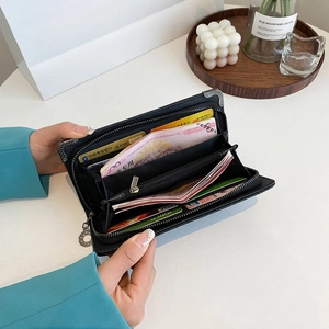 Black leather long clutch wallet with carbon fiber corners and multi-card slot storage