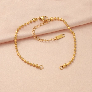 Polished gold beaded stainless steel bracelet with lobster clasp and extender chain