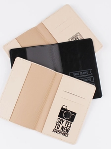 Travel PU leather passport holders with adventure quotes and card slots on white background