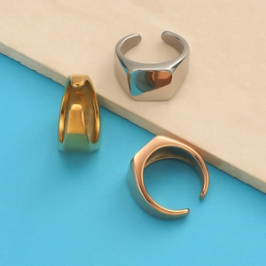 Three minimalist mirror-polished stainless steel rings in gold, silver, and rose gold