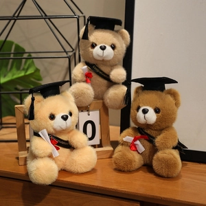 Three graduation teddy bears in various browns with caps and congratulation sashes