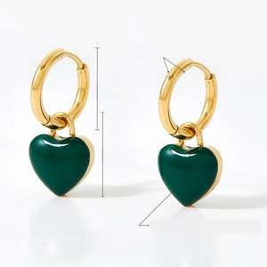 Close-up of heart earrings featuring 14mm dark green enamel pendants on gold hoops