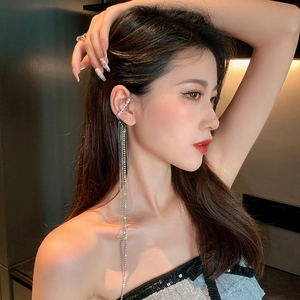 Elegant silver tassel earrings for women with rhinestones and faux pearls on model