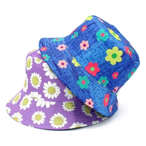 Dual-sided floral bucket hats featuring purple daisy and blue denim flower patterns