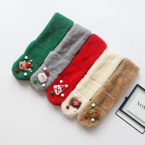 Flat lay of colorful Christmas faux fur scarves for kids with festive cartoon motifs