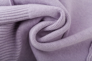 Detail shot of the lavender knit texture and ribbed cuff on this long sleeve cardigan