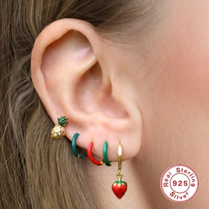 S925 sterling silver fruit earrings set with pineapple and strawberry charms on model