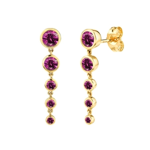 Detail of s925 silver needle drop earrings with graduated magenta zircon stones in gold