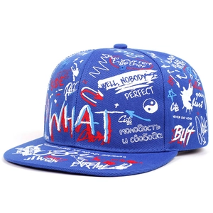 Detail of royal blue street style baseball cap featuring vibrant graffiti pattern print