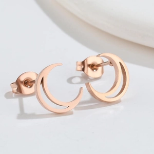 Elegant rose gold crescent moon stud earrings with a minimalist geometric openwork design