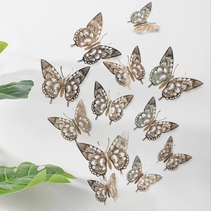3D hollow butterflies on white wall with green leaf decor in champagne gold and silver