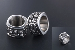 Detail view of retro titanium steel skull relief band ring with gothic punk engraving