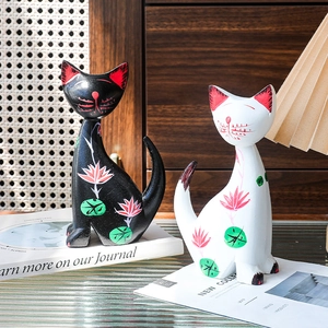 Set of two Nordic hand-painted wooden cat statues with pink floral patterns for home decor
