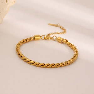 Macro detail of 18K gold-plated stainless steel rope chain bracelet with lobster clasp