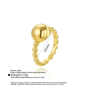 Detailed view of an 18k gold plated copper ring featuring a minimalist bead design