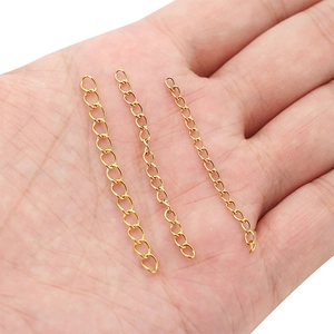 Three 18k gold stainless steel extension chains held in hand for DIY jewelry making