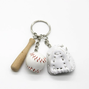 Close-up of baseball keychain with wooden bat, white glove, and ball detail
