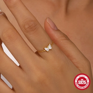 Elegant S925 sterling silver butterfly chain ring with sparkling teardrop zircons on a hand