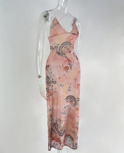 Close-up of pink paisley and floral print mesh fabric on a slim fit maxi dress