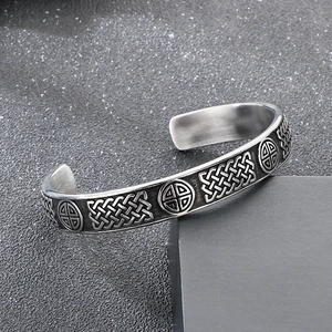Macro detail of Nordic Viking bangle showing Celtic knots and antique relief patterns
