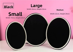 Size comparison of black jewelry display stands in small, medium, and large dimensions