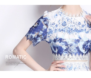 Detail of elegant hollow lace collar and blue floral print on luxury midi dress