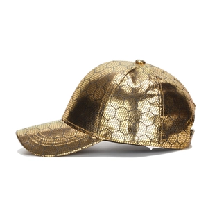 Golden PU leather baseball hat featuring a hexagonal honeycomb texture from 45-degree angle