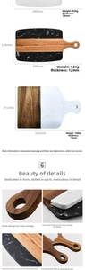 Detail of acacia wood and marble cutting board with integrated handle and hanging hole