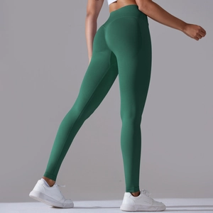 Close-up of seamless forest green yoga leggings with high waist and push-up effect