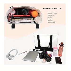 Detail showing large capacity of the black and white canvas tote bag for daily essentials