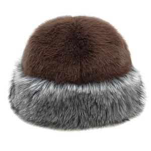 Detailed close-up of two-tone faux fox fur Mongolian hat with thick warm plush texture