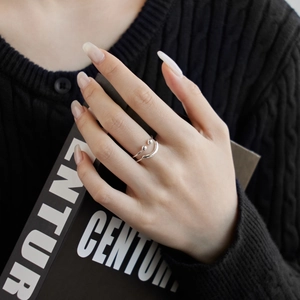 Detail of S925 sterling silver double-layered open hollow smiley face ring on model finger