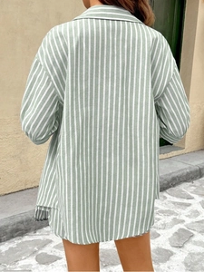 Rear view of loose green and white striped maternity shirt with cotton-linen texture