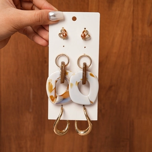 Detail view of a 6-piece earring set with acrylic, pearls and rhinestones on card