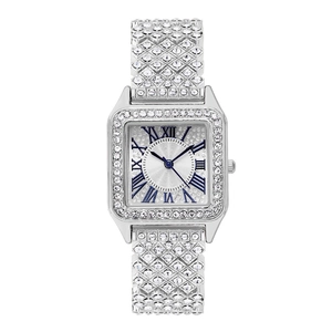 Detail of luxury square silver watch with sparkling rhinestones and blue numerals