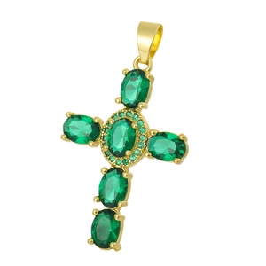 Detailed close-up of golden cross pendant featuring green oval gemstones and zircons