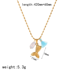 Golden seashell conch pendant necklace with white gemstone and blue tassel on a bead chain