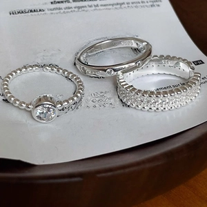 Detailed close-up of a three-piece S925 sterling silver stacking ring set with cubic zirconia