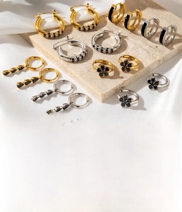 Detailed display of French vintage titanium steel earrings with zircon flowers and drop designs