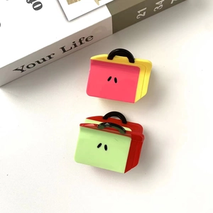 Cute backpack shaped acetate hair claw clips in pink and green for girls and women