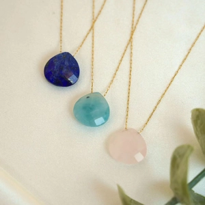 Three teardrop natural stone necklaces in blue and pink with gold stainless steel chains