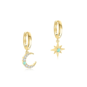 Macro detail of asymmetric gold hoop earrings with opal stars and moon pendants