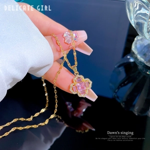 Luxurious gold clover necklace with pink crystal inlay and pavé micro-set details