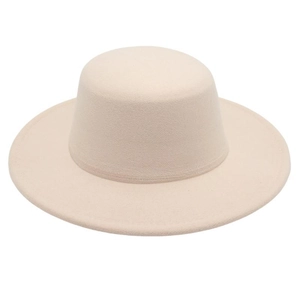 Detail shot of the flat top and wide brim of a cream-colored minimalist wool felt boater hat