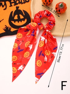 Halloween ribbon hair scrunchie with pumpkin and ghost prints on red satin fabric