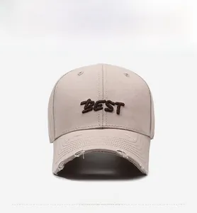 Detail of vintage beige baseball cap with BEST 3D embroidery and distressed brim details
